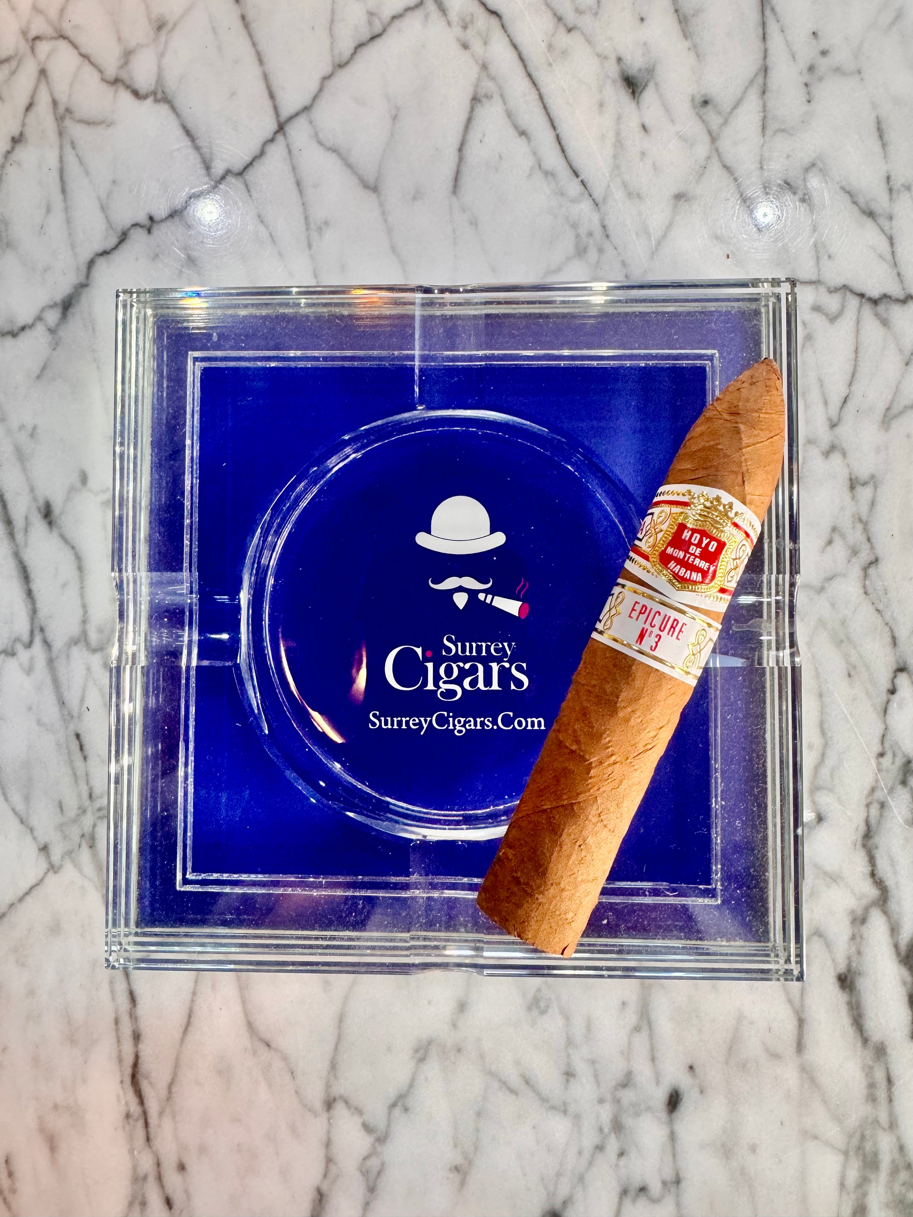 Hoyo de Monterrey Epicure No.3 cigar with Surre Cigars branding on a marble surface