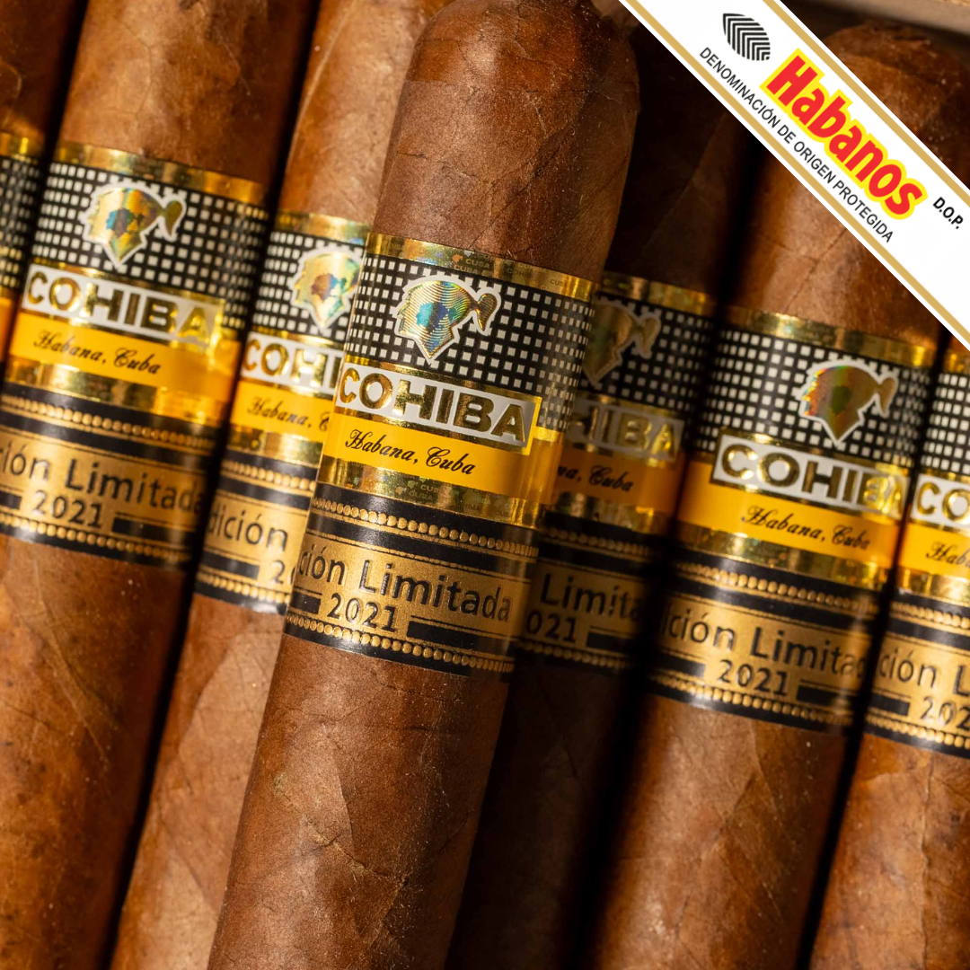 Close-up of several Cohiba 55 Aniversario Limited Edition 2021 cigars with black and gold bands, arranged vertically. A diagonal banner in the top right reads 'Habanos'.