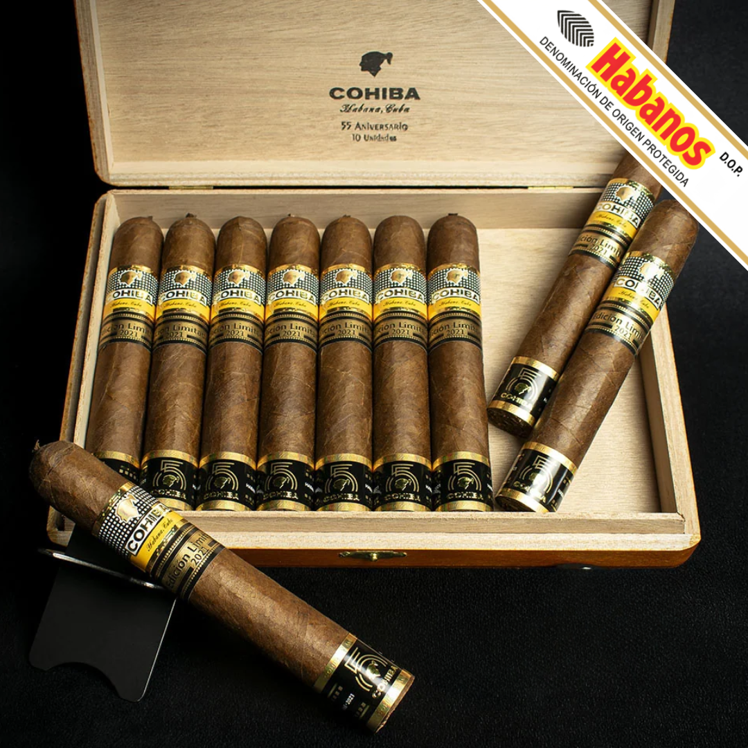 An open wooden Cohiba 55 Aniversario Limited Edition 2021 cigar box displaying ten cigars inside, with three additional cigars placed outside the box on a black background. A diagonal banner in the top right reads 'Habanos'.