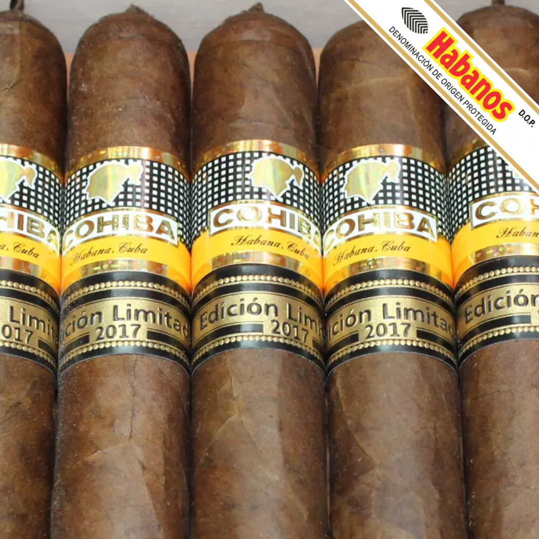 Several Cohiba Talisman Limited Edition 2017 cigars are arranged upright in a close-up view, showing the brown leaf wrappers and black-and-gold bands with Cohiba branding. A diagonal promotional banner in the top-right corner reads Habanos.